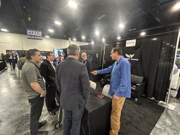 People lining up at the Miami booth asking for information