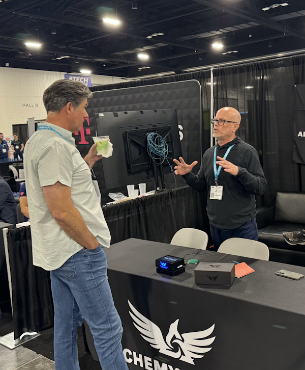 Tim explaining the product to interested attendees